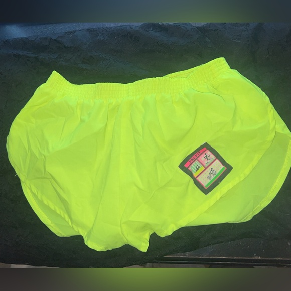 Tri-fit neon yellow shorts/ size large would fit best a medium or large - Picture 1 of 5